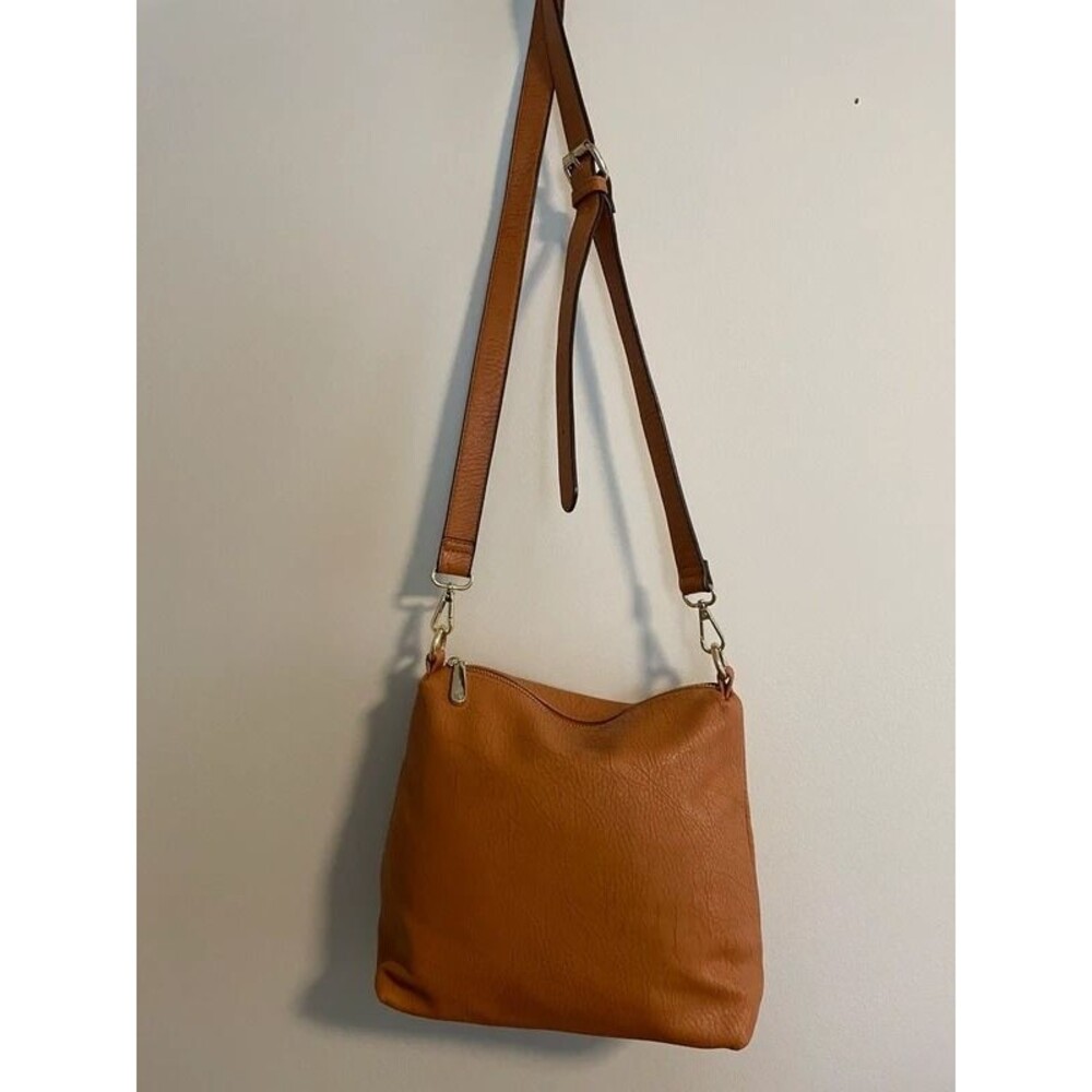 Charming Charlie tan Crossbody bag with adjustable strap